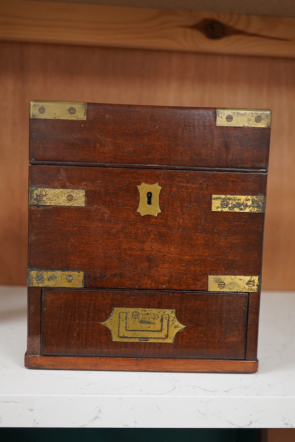 An early 19th century mahogany apothecary box, containing ten glass bottles, one with original paper label for the chemist Elam, 196 Oxford Street, London, with draw beneath containing a pair of scales, and weights, etc.